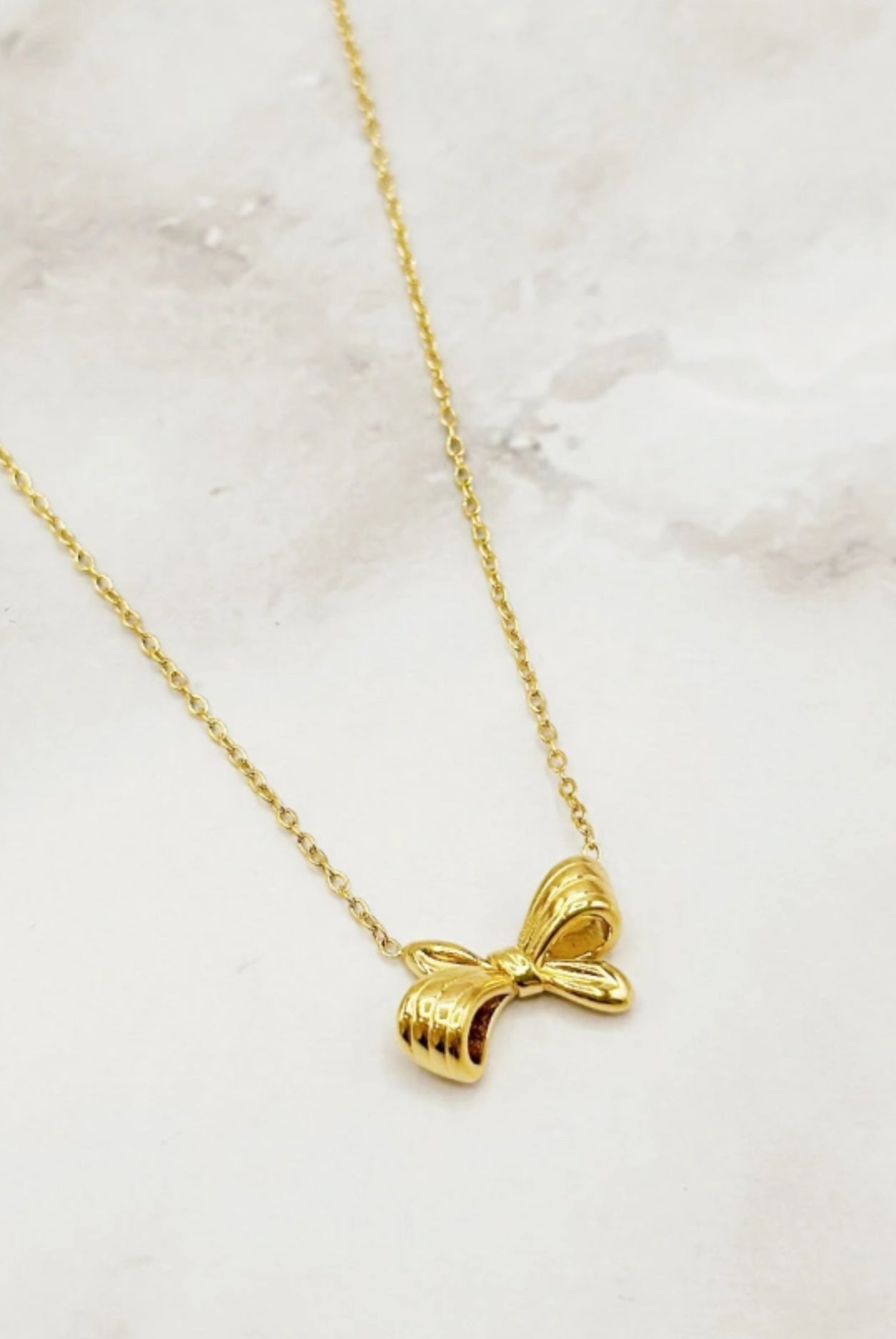 Pendentif noeud de papillon